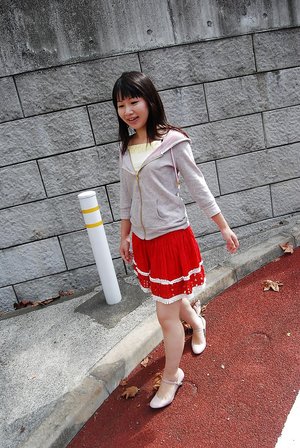 1 dark haired female tortures another during lezdom play in concrete cellar